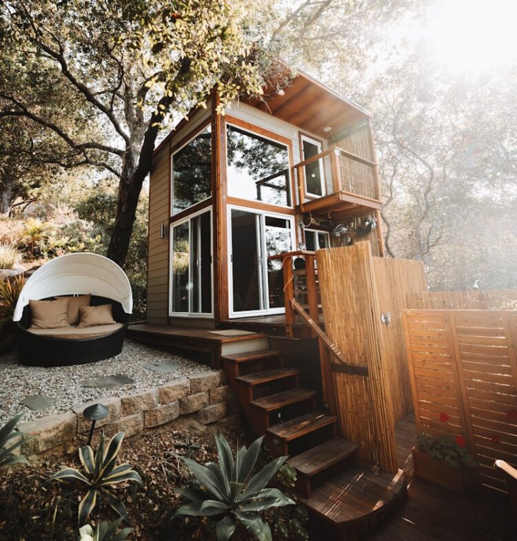 brown wooden house near trees during daytime