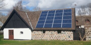 a house with a solar panel on the roof