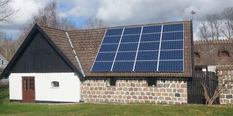 a house with a solar panel on the roof