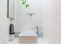 white ceramic sink with faucet