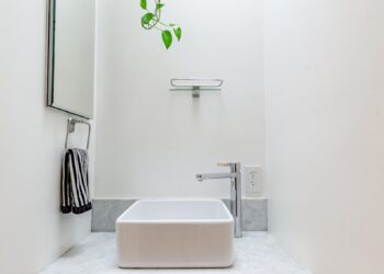 white ceramic sink with faucet
