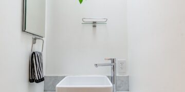 white ceramic sink with faucet