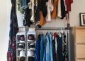clothes hanged on brown wooden cabinet