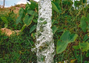 a pipe that has water coming out of it