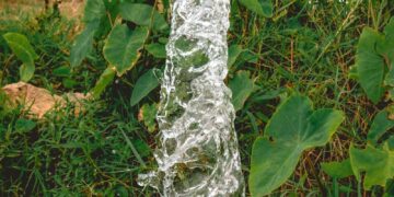 a pipe that has water coming out of it