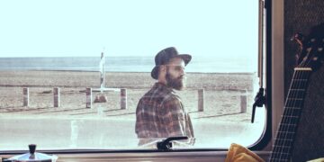 natural finish guitar on chair