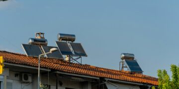 three solar panels on the roof of a building