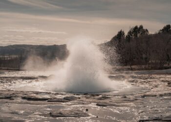 A geyser erupts water into the air.