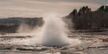 A geyser erupts water into the air.