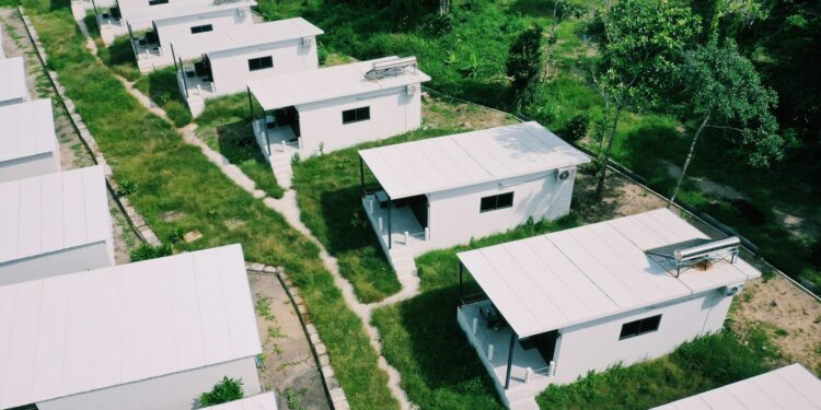 white concrete building near green trees during daytime