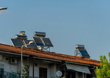 three solar panels on the roof of a building