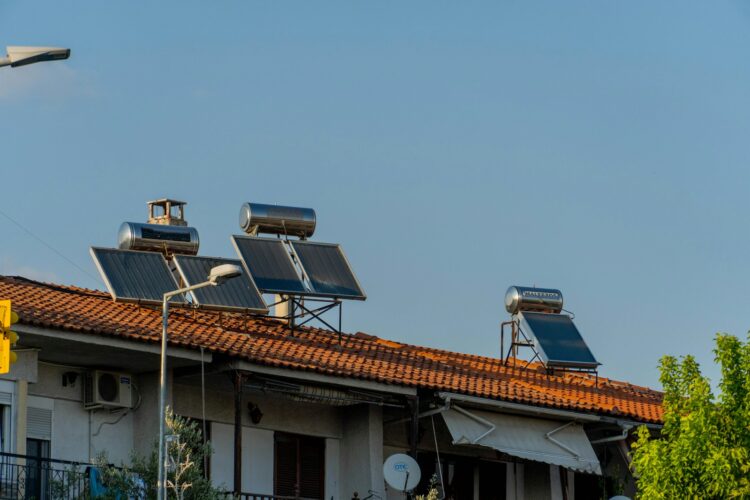 three solar panels on the roof of a building