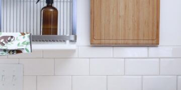 tray of apples near brown bottle