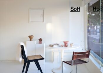 A white room with a table and chairs