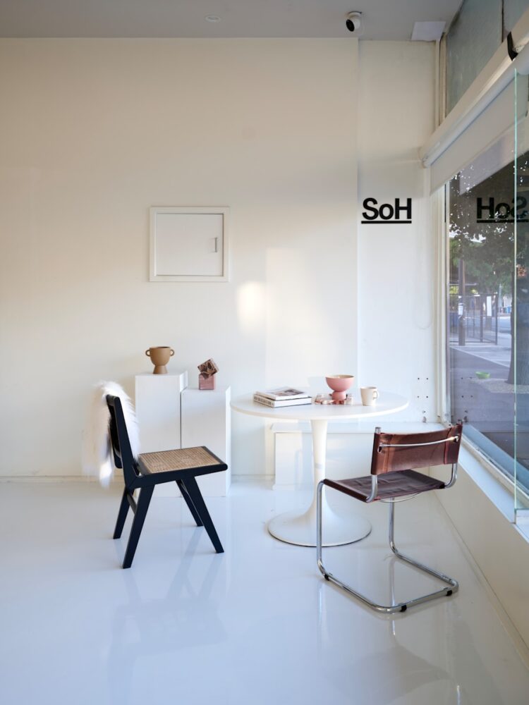 A white room with a table and chairs
