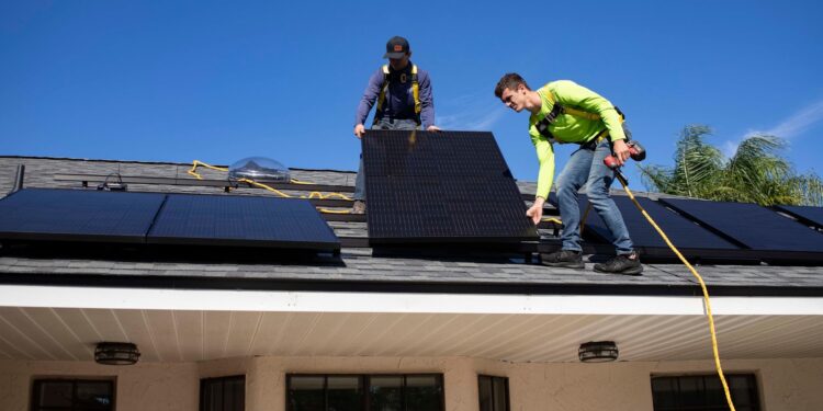 men on top of a roof