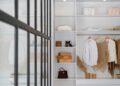 white bath towel on white wooden cabinet