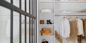 white bath towel on white wooden cabinet