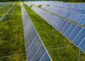 Aerial view of solar panels in a green field, Rossville, GA.
