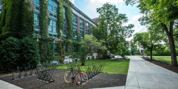black bicycle parked in front of building
