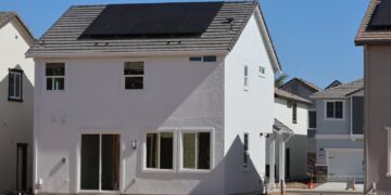 Newly constructed eco-friendly home in Elk Grove, CA, featuring rooftop solar panels for sustainable energy.