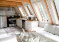 Bright and stylish A-frame cabin interior in Stowe, Vermont featuring modern design and rustic elements.