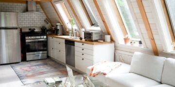 Bright and stylish A-frame cabin interior in Stowe, Vermont featuring modern design and rustic elements.