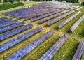 Aerial perspective of a solar farm in Kellogg, Minnesota, showcasing renewable energy technology.
