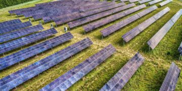 Aerial perspective of a solar farm in Kellogg, Minnesota, showcasing renewable energy technology.