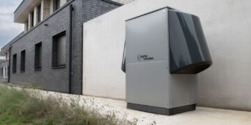 Innovative heat pump system by alpha innotec installed outside a contemporary building.